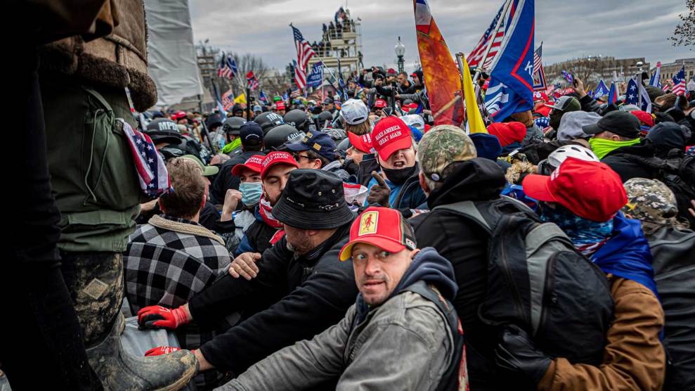 A pro-Trump mob with flags in front of the US Capitol