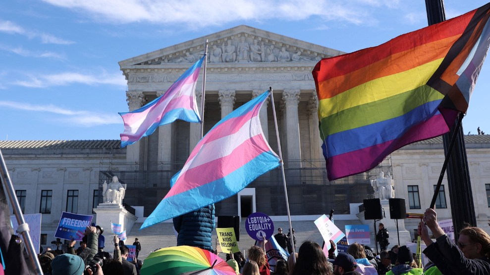 Trans and LGBT pride flags fly in front of the Supreme Court