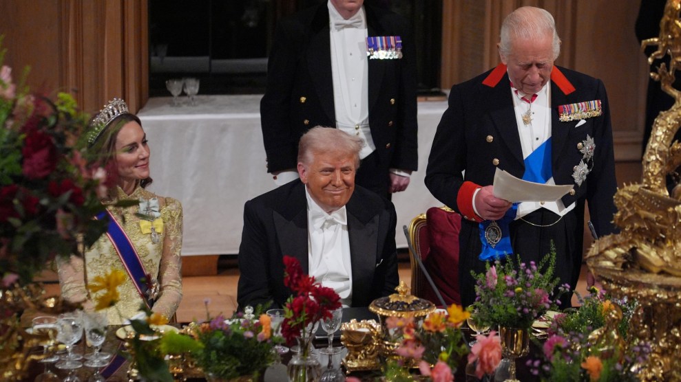 Trump smiles during a dinner with King Charles.