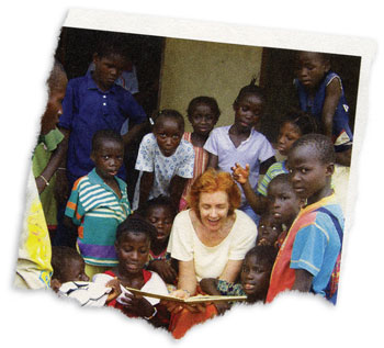 A woman reading to orphan kids