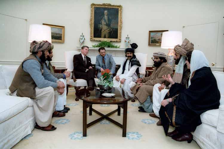 Reagan sitting with afghan freedom fighters