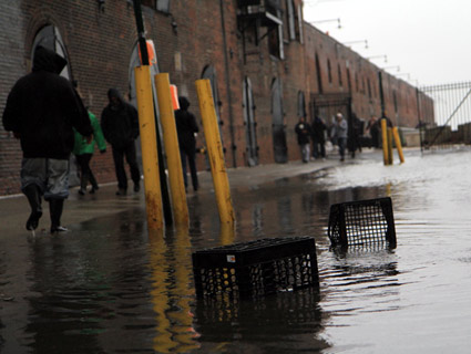 In Red Hook, a neighborhood along New York Harbor featuring low-lying land and industrial piers, sandbags weren't enough to prevent flooding, not just of seawater but also curious tourists, locals and television vans. James West