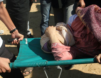Nov. 15, 2012 - Khan Younis, Gaza Strip, Palestinian Territory - Palestinian medics treat a wounded woman at a hospital after an Israeli air strike in Khan Younis in the southern Gaza Strip  (Credit Image: © Eyad Al Baba/APA Images/ZUMAPRESS.com)