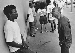 In South Central L.A., a gang-intervention counselor talks with a youth named Kemo, who was later killed.